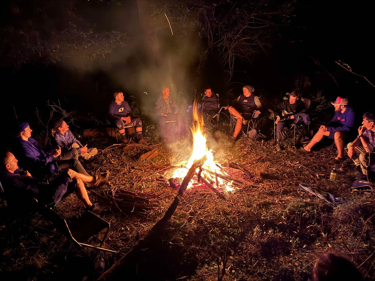 Group of mountain bike riders at sunset
