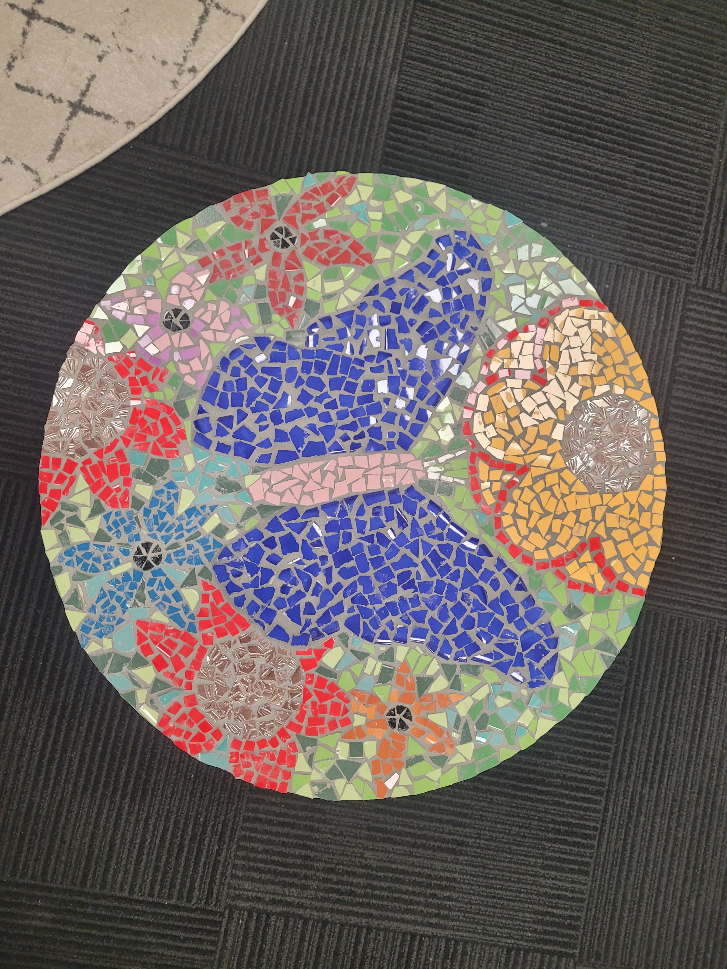 Participants piecing together a colourful mosaic
