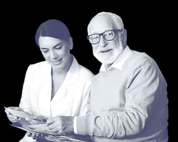 Healthcare professional and client reviewing documents together