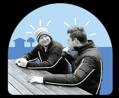 Two people talking at a table