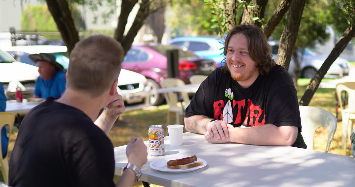 Two people having a counselling conversation outdoors